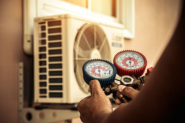 Professional Air Conditioning Service technician working in Elmore, AL